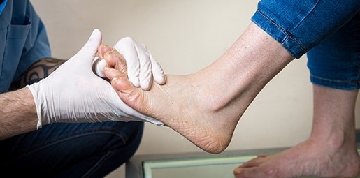 Foot being looked at by a health professional