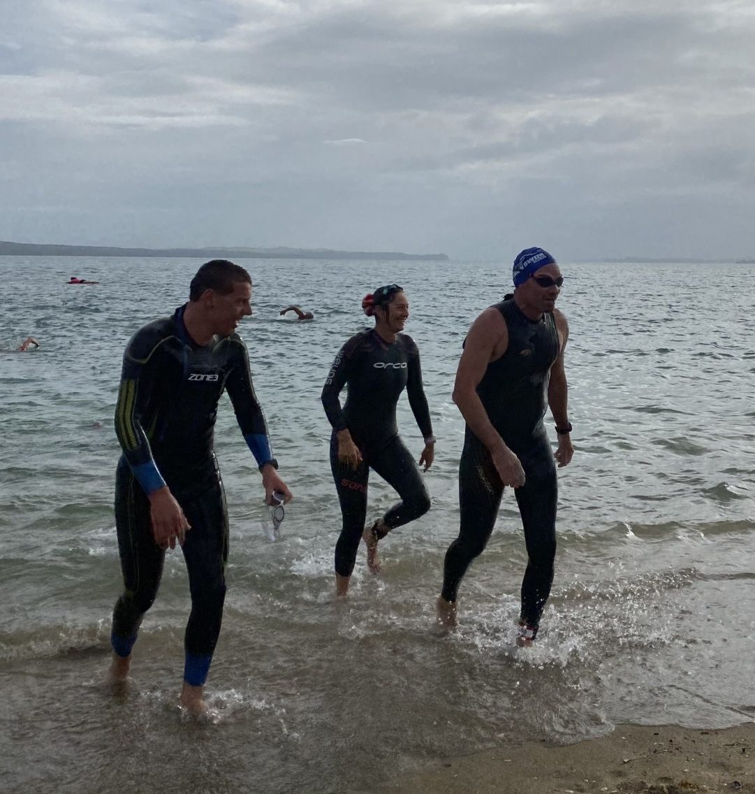 Duncan Grant and two others walking out from the sea