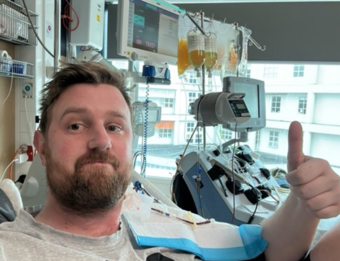 Chris Long photo of getting infusion with thumbs up
