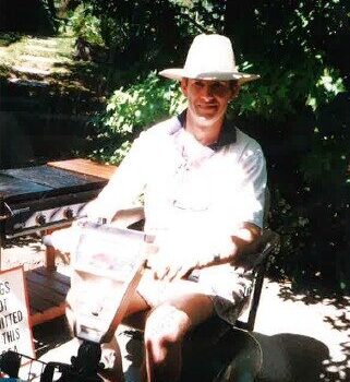 David Ashton in motorised wheelchair smiling
