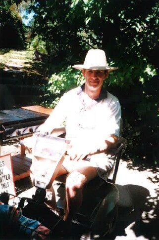 David Ashton in motorised wheelchair smiling